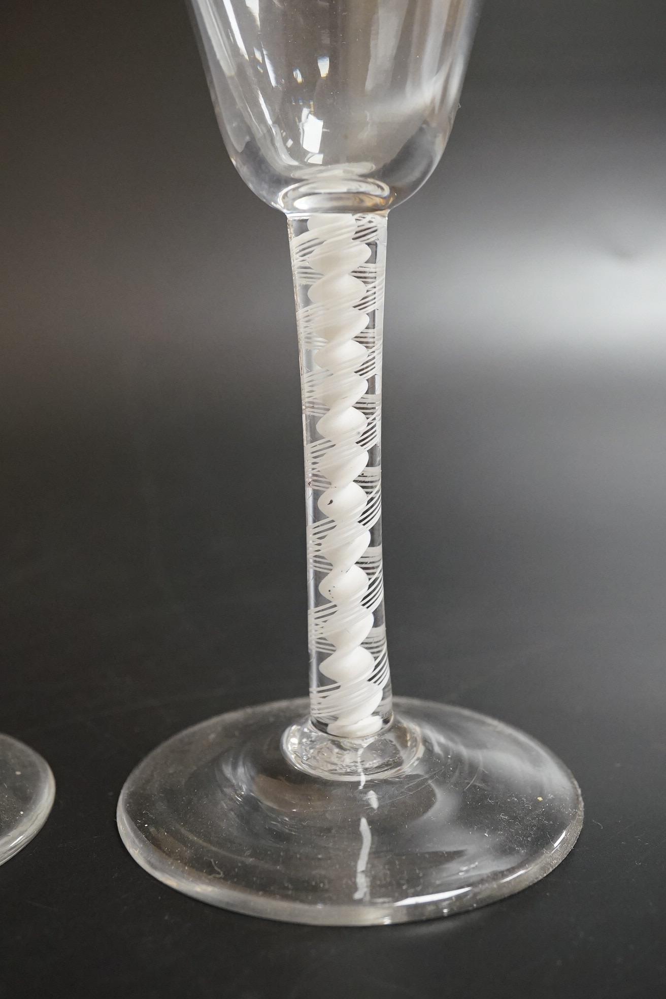 Two DSOT stem wine glasses, c.1760, with funnel shaped bowls, tallest 16.5cm high